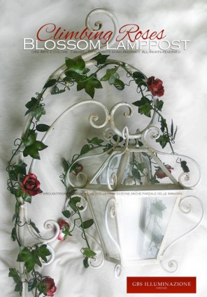 Lamppost lantern with forged arm and climbing roses for outdoor use. Ivy and roses in aged paint, just like the white gloss forged arm from the ground. Made to order.