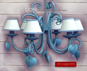 Light blue wrought iron chandelier featuring central pendant with hearts.